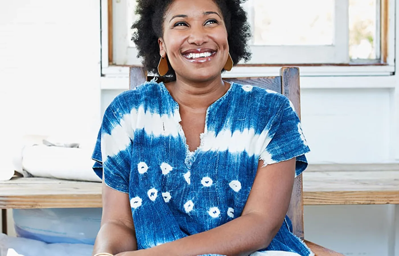 Business owner smiling in a bright workspace