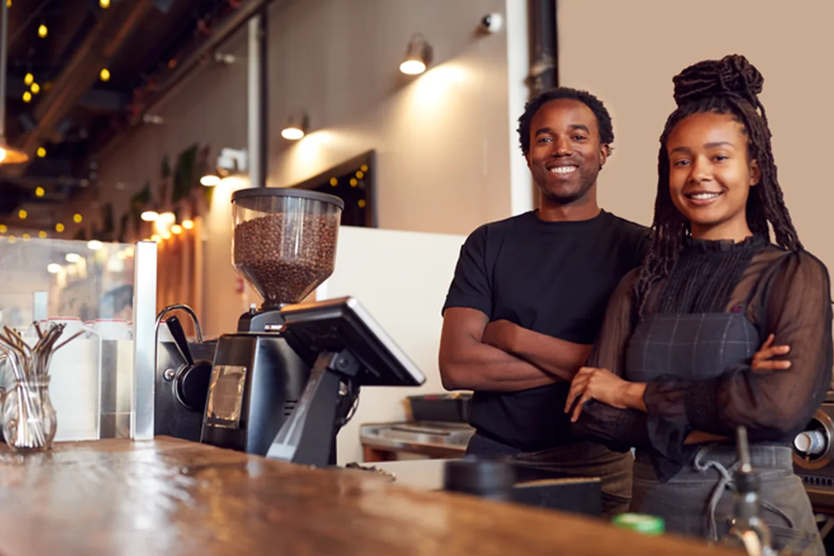 Coffee shop owners behind their counter
